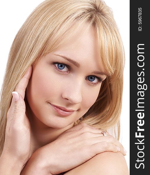Portrait of a young beautiful blonde woman with light blue eyes and natural make-up. Portrait of a young beautiful blonde woman with light blue eyes and natural make-up