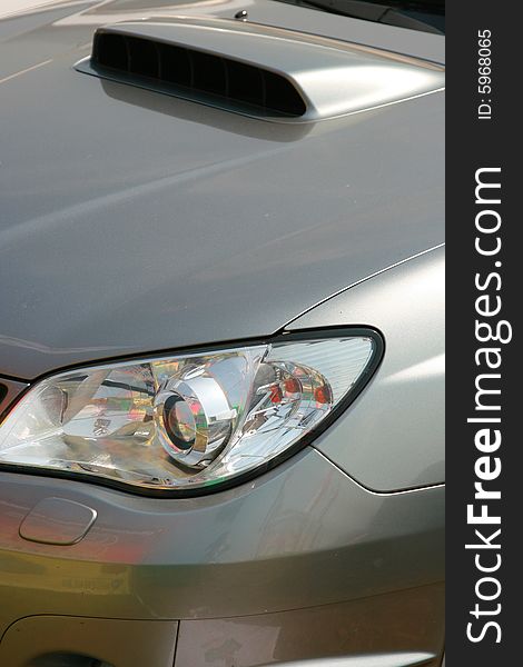 Forward headlight of the sports car of metal color