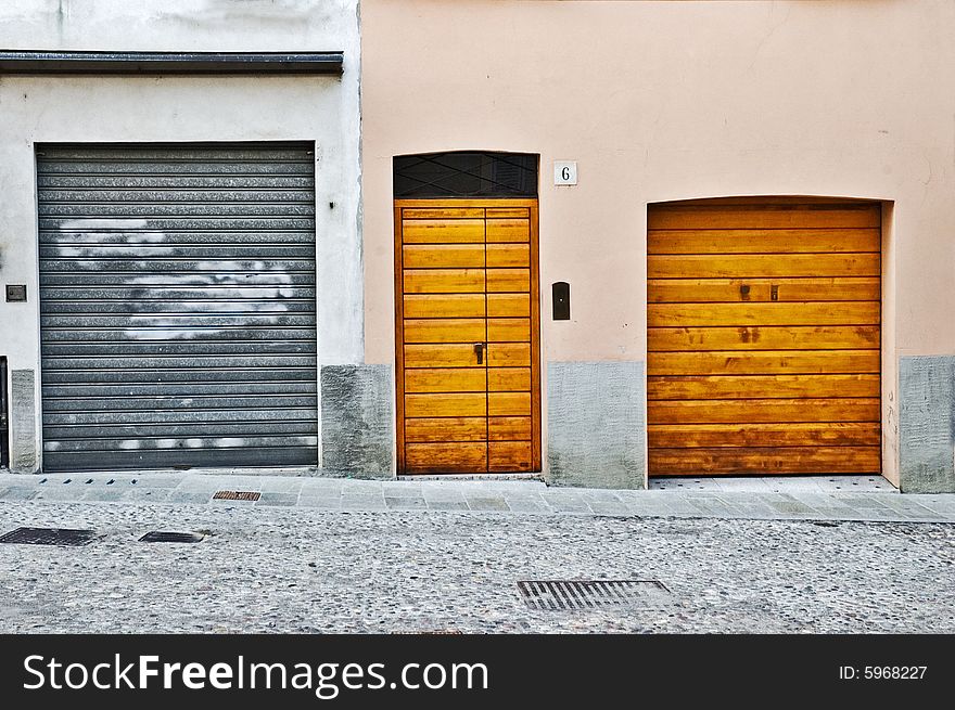 Three doors in the city of Parma, Italy