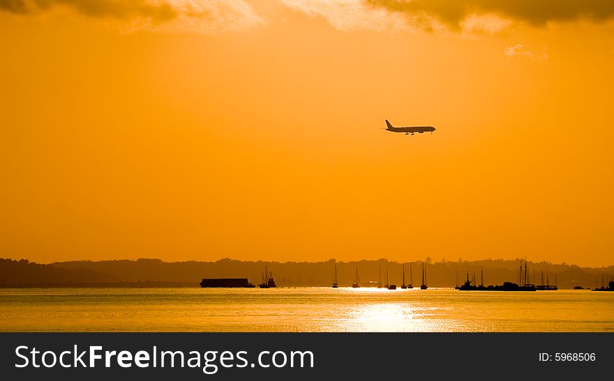 Passenger jet descending to land in the early morning. Passenger jet descending to land in the early morning