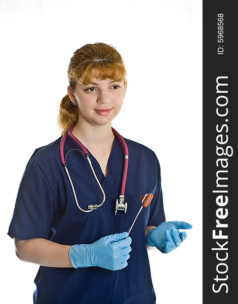 Young female doctor with stethoscope and neurological percussion hammer over white background