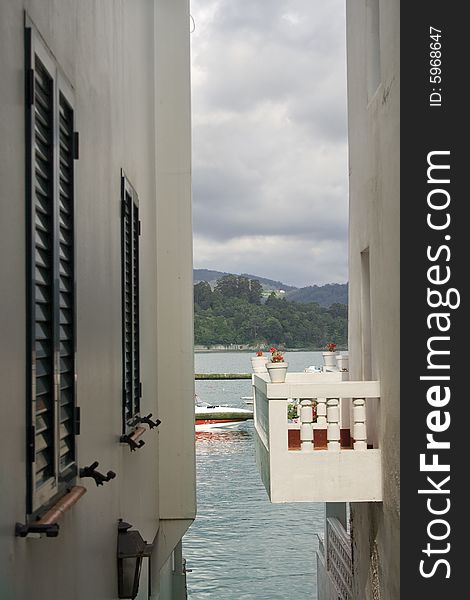 Narrow street and balcony close to sea