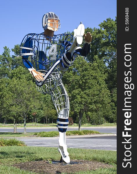 Football player made from steel rods and plates.