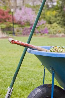 Wheelbarrow And Rake Royalty Free Stock Photography Wheelbarrow And Rake Royalty Free Stock Photography