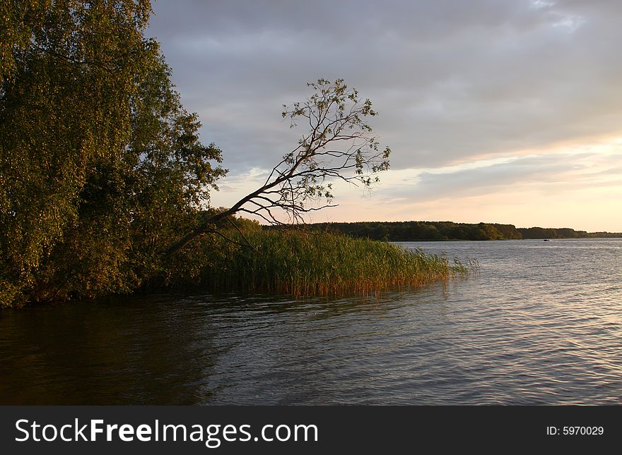 Large river Volga in the dusk with red sunlight