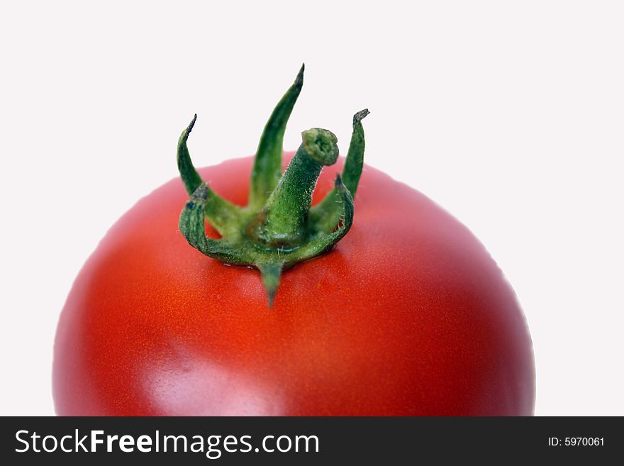 A fresh tomato isolated on white background