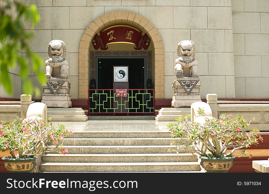 Gateway to the Chinese temple, guarded stone lions