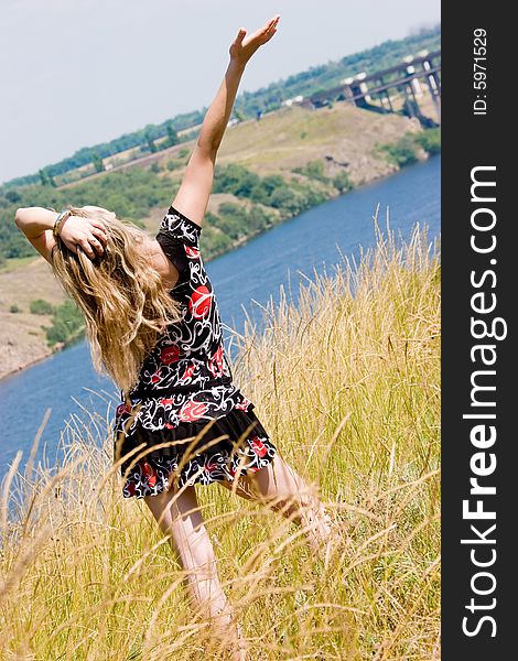 Pretty young girl on blue river background. Pretty young girl on blue river background