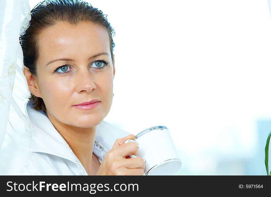 High key portrait of nice gorgeous woman drinking coffee. High key portrait of nice gorgeous woman drinking coffee