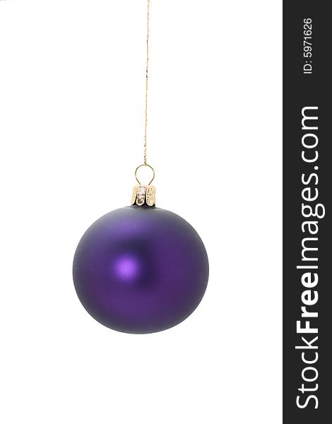 A violet christmas ball hanging from golden thread, shot in studio isolated on white. Perfect for your holiday designs or ads