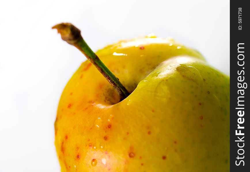 Plum with water drops isolated over white