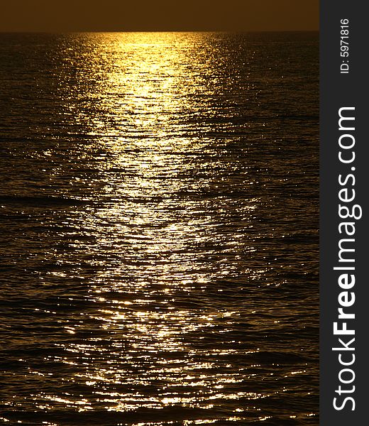 A wonderful shot of the sunlight on the sea in the sunset hour. A wonderful shot of the sunlight on the sea in the sunset hour