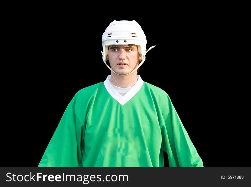 A young hockeyball player on the black background