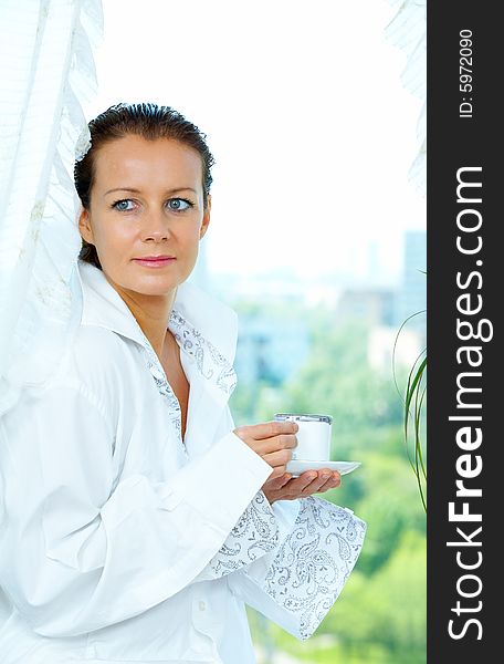 High key portrait of nice gorgeous woman drinking coffee