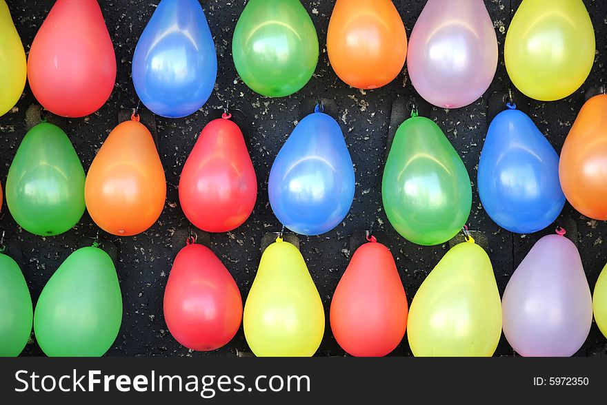 Colorful balloons at an amusement park.
