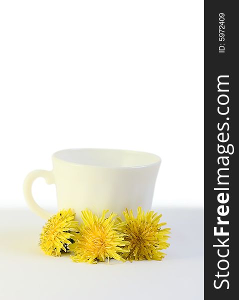 Cup And Flowers Isolated On White