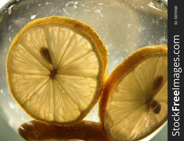 Pieces of lemon in the water