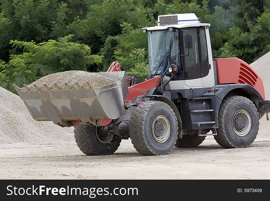 Bulldozer at work in place of errection