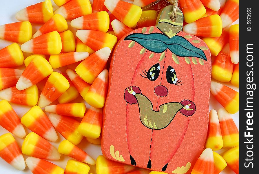 Candy corn and decorative halloween pumpkin. Candy corn and decorative halloween pumpkin