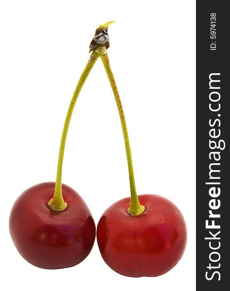 Pair cherries of red color are connected by stalks. Ripe and appetizing!. Pair cherries of red color are connected by stalks. Ripe and appetizing!