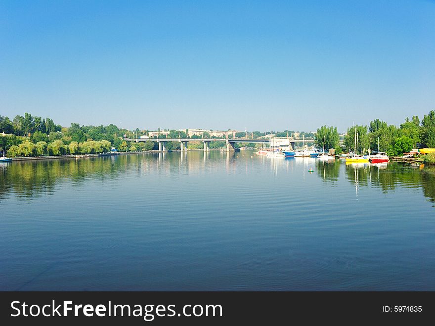 Cityscape panoramic view with bridge and sailing yacht. Cityscape panoramic view with bridge and sailing yacht