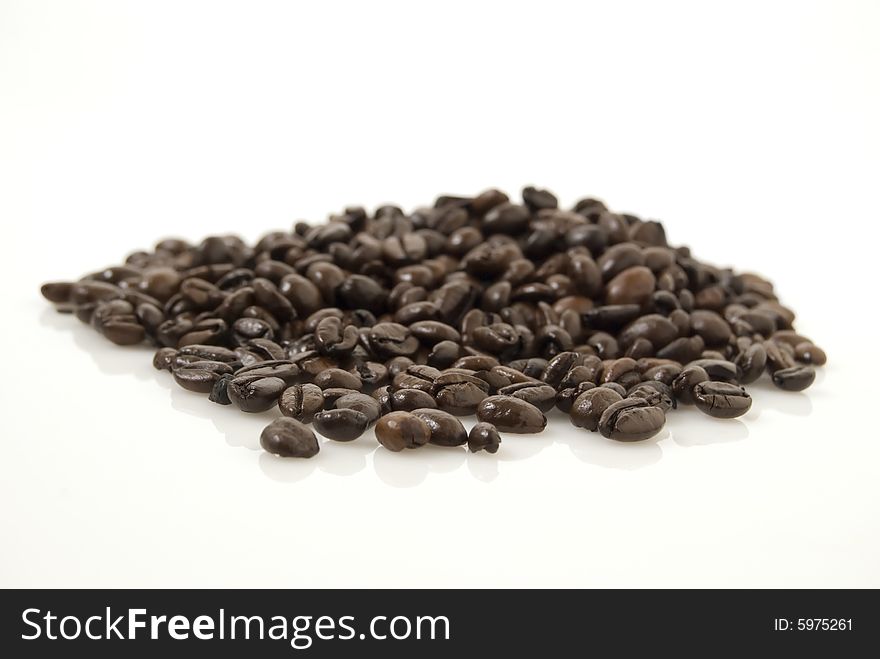 Closup shot of coffee beans against white background