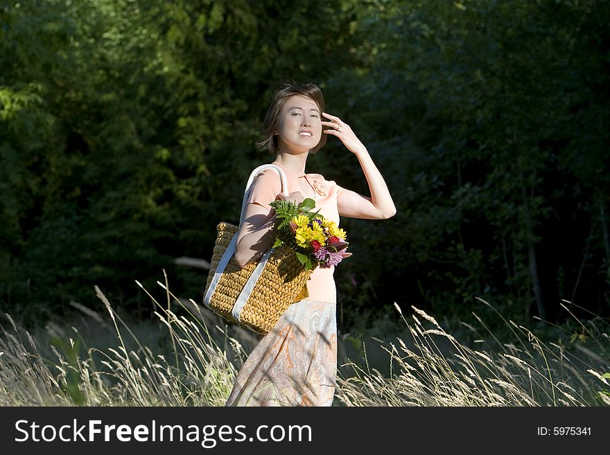 Woman In A Field Of Grass Smiling - Horizontal