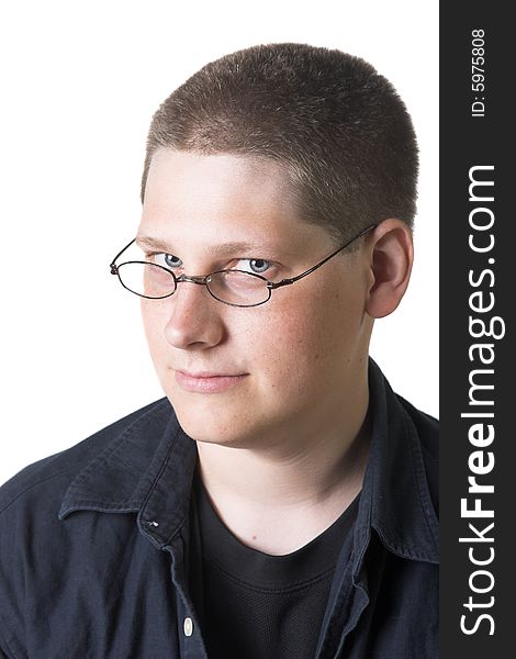 Young blond man with glasses against a white background.