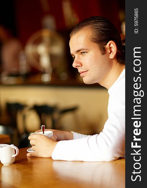 Young Man And Cup Of Coffee