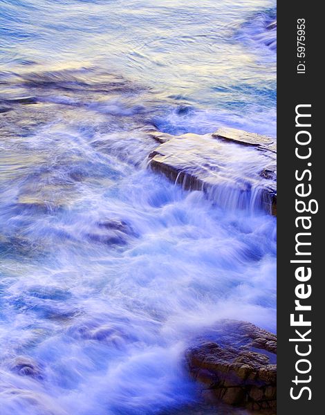 Wave washing on Boiling Pot Rocks, Noosa, Queensland, Australia, using a long exposure to blur water. Wave washing on Boiling Pot Rocks, Noosa, Queensland, Australia, using a long exposure to blur water.