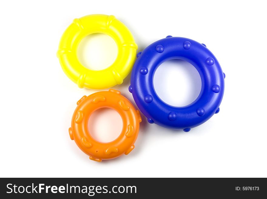 A photograph of circle toy cogs. A photograph of circle toy cogs