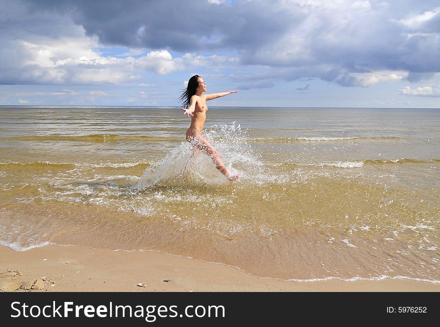 Naked Girl Running On The Beach