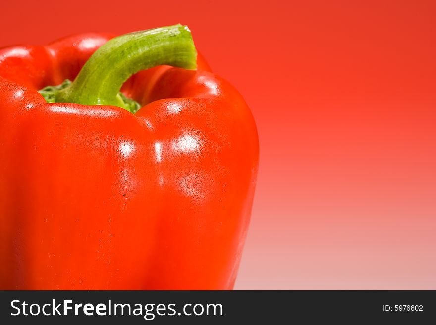 Red bell pepper lit with red gradient lighting. Red bell pepper lit with red gradient lighting