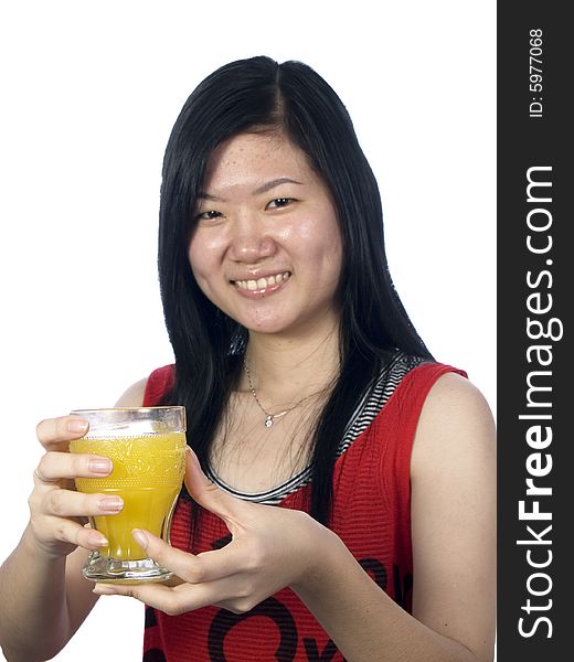 The girl shows a cup of juice with white background