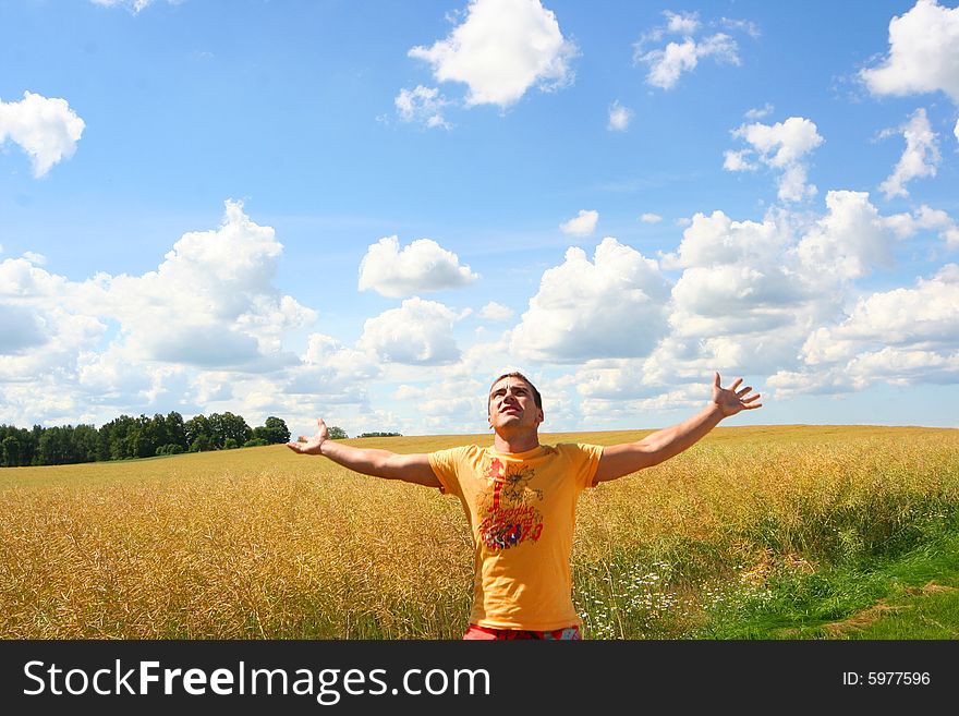 Cute young guy relaxing outdoors. Cute young guy relaxing outdoors