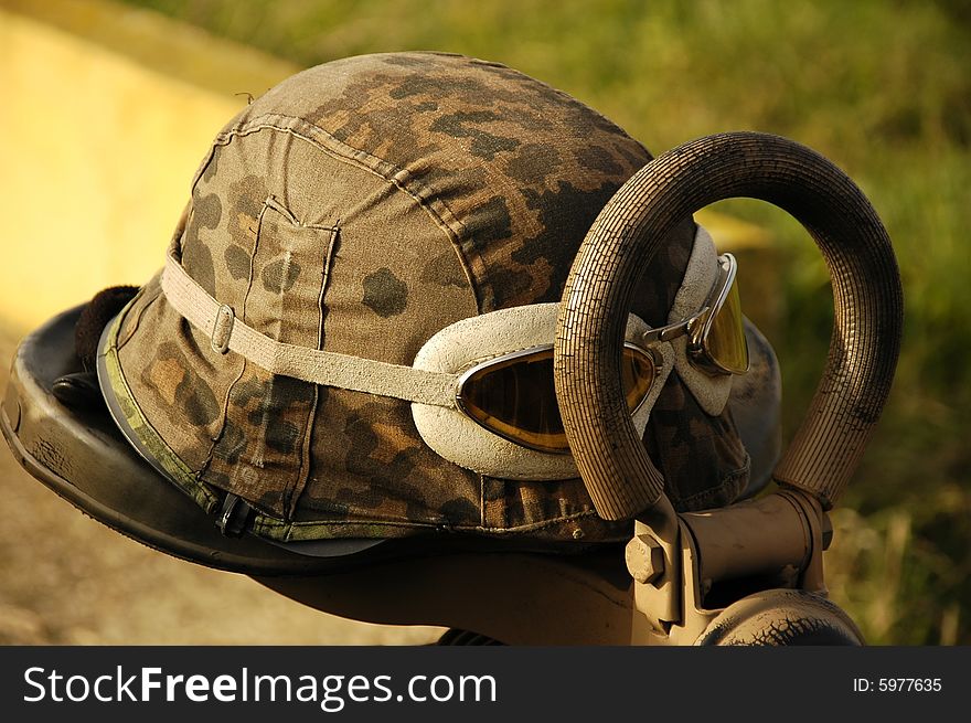 Helmet and gun on the motor-cycle. Helmet and gun on the motor-cycle