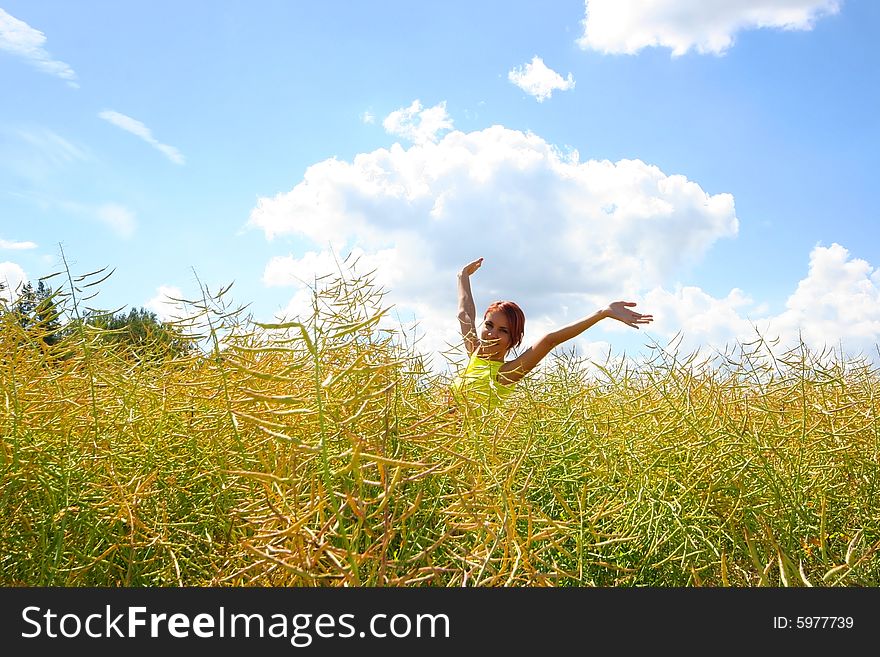 Happy young girl relaxing on yellow meadow. Happy young girl relaxing on yellow meadow