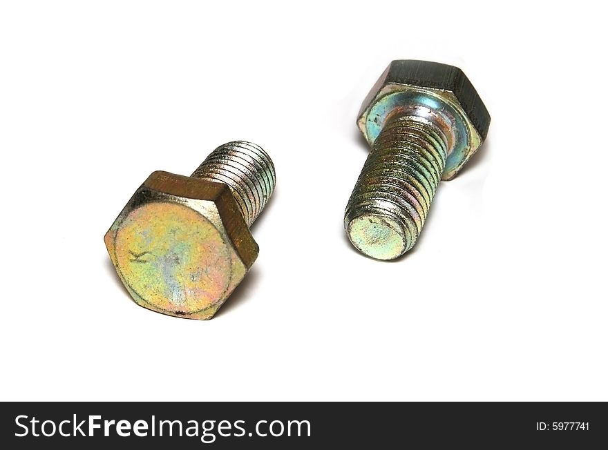 Two iridescent screws, is isolated on a white background. Two iridescent screws, is isolated on a white background.