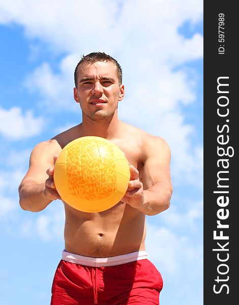 Guy with yellow ball outdoors. Guy with yellow ball outdoors