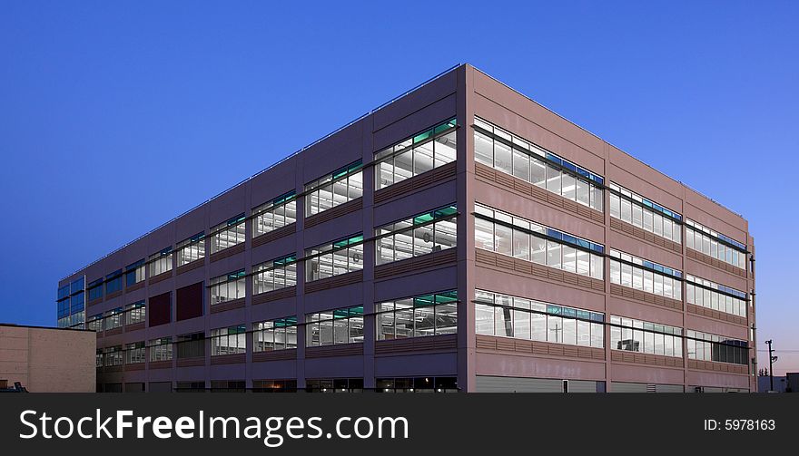 An office building with a empty parking lot