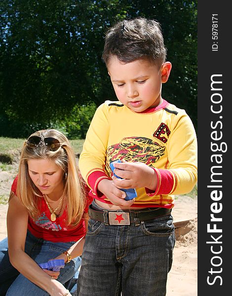 Young mother with cute son (boy in focus)