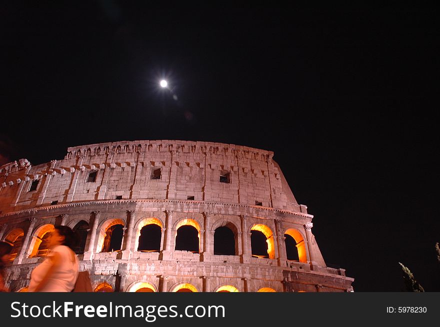 Rome-Colosseum by night with the moon