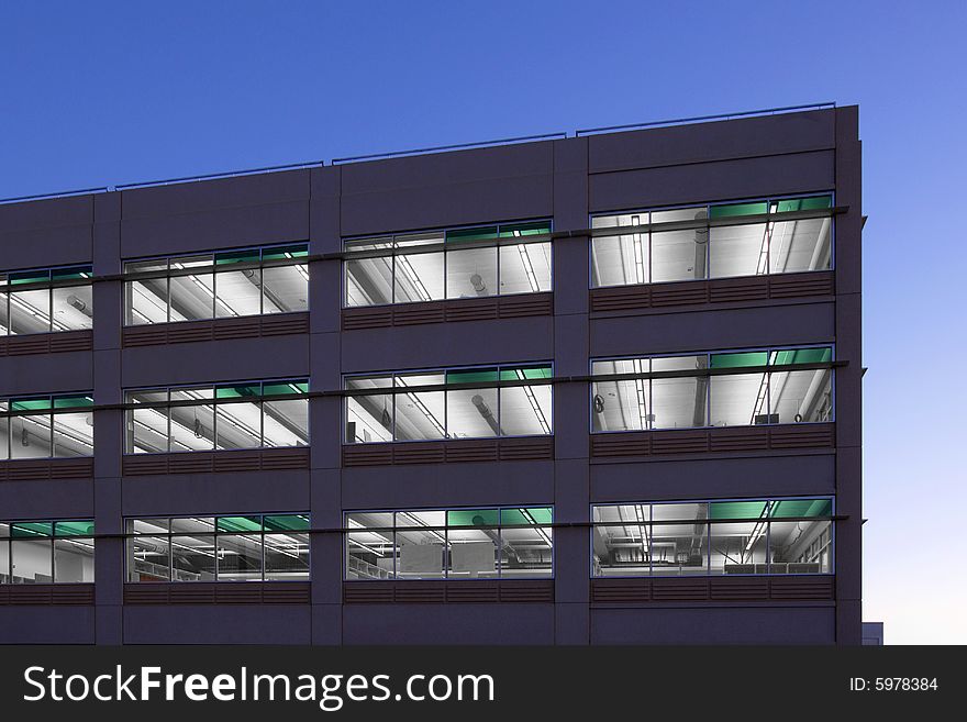 An office building with a empty parking lot