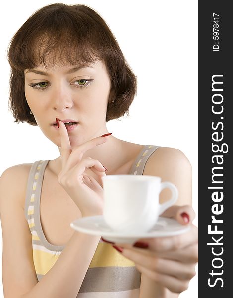 A photo of beautiful woman thinking over the first cup of tea or coffee. A photo of beautiful woman thinking over the first cup of tea or coffee