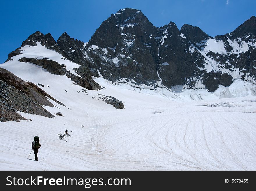 Alpinists  on glacier in Caucasus mountains. Alpinists  on glacier in Caucasus mountains