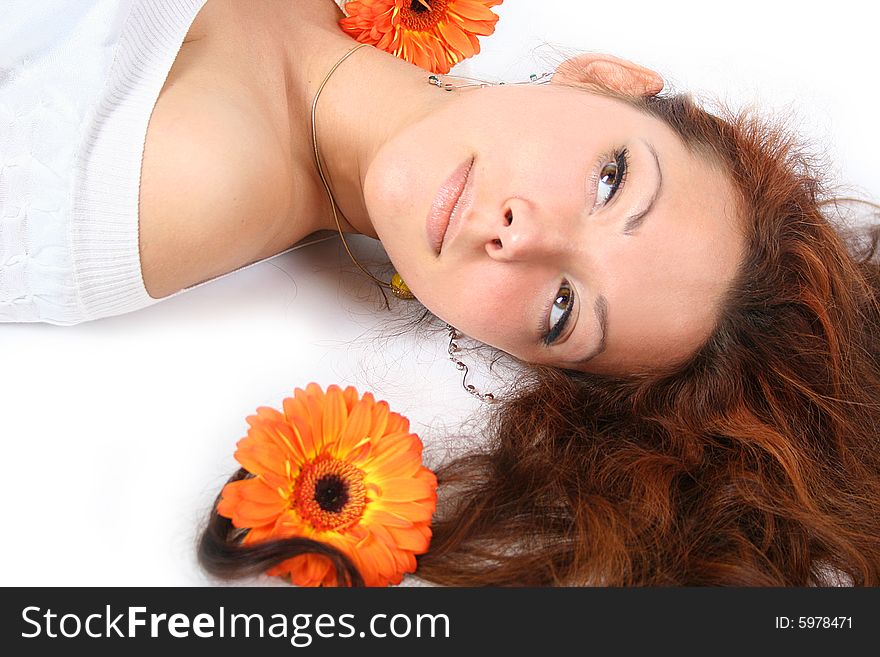 Beautiful young girl with flowers is relaxing. Beautiful young girl with flowers is relaxing