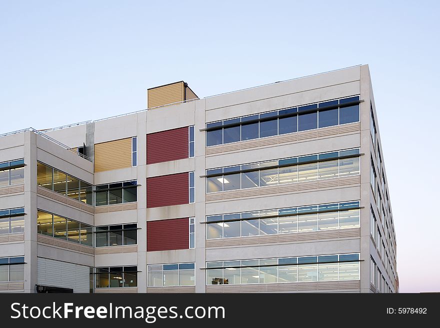 An office building with a empty parking lot