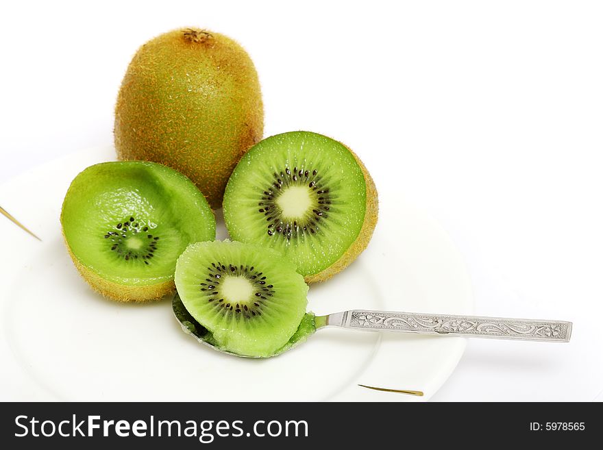 Kiwi fruit sliced into half and digged out the flesh using small spoon. Kiwi fruit sliced into half and digged out the flesh using small spoon.