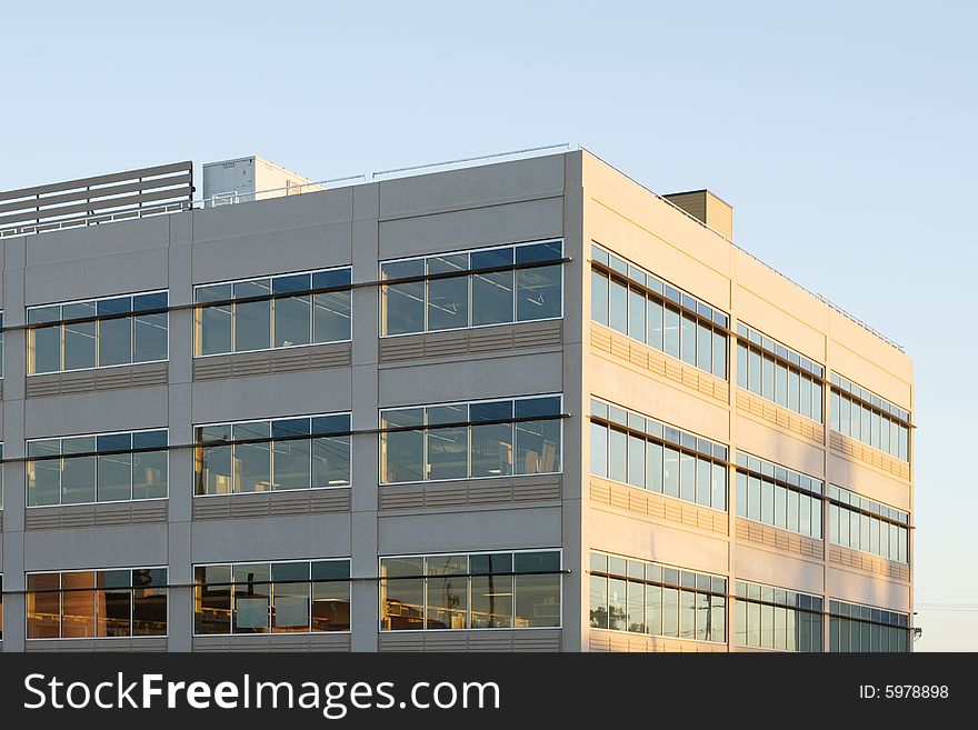 An office building with a empty parking lot