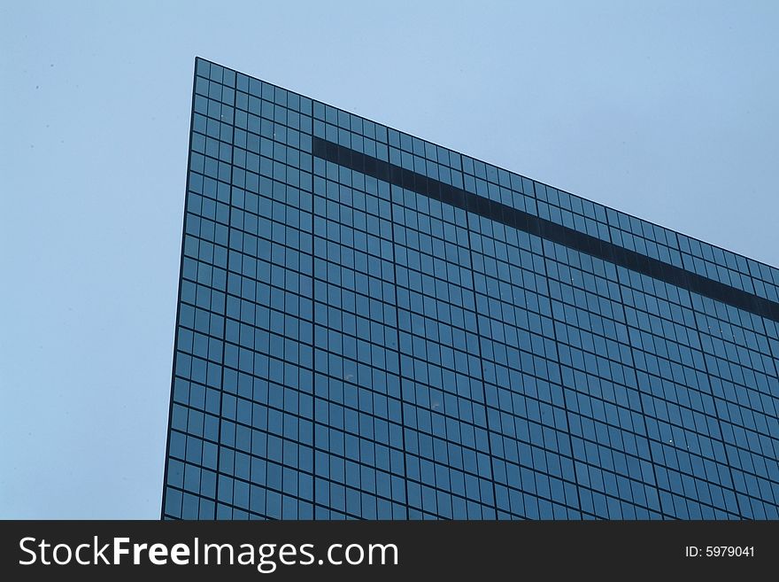 Mirrored skyscraper against blue sky in Boston. Mirrored skyscraper against blue sky in Boston